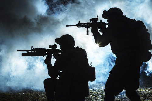 Black silhouettes of soldiers in the smoke, moving in battle operation. Poster Print by Oleg Zabielin/Stocktrek Images ( - Item # VARPSTZAB102428M