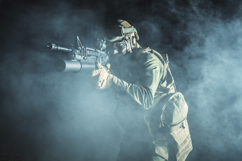 Backlit photo of a soldier moving amonst the smoke during a battle operation. Poster Print by Oleg Zabielin/Stocktrek Im - Item # VARPSTZAB102432M