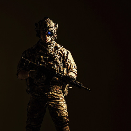 US Army rangers in combat uniforms with his shirt sleeves rolled