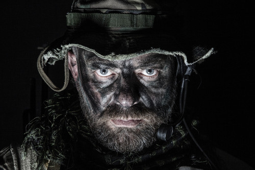 Studio shot of a U.S. special forces soldier wearing a jungle hat and Shemagh with painted face. Poster Print by Oleg Za - Item # VARPSTZAB102735M