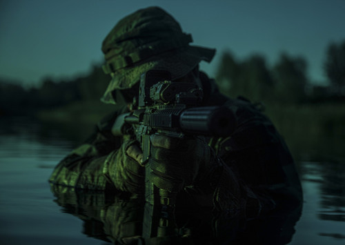 Special forces soldier with rifle in action during a river raid in the jungle under the cover of darkness. Poster Print - Item # VARPSTZAB102775M