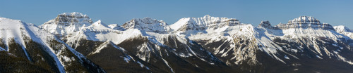 Panorama of snow-covered mountain range and blue sky; Banff, Alberta, Canada Poster Print by Michael Interisano / Design Pics - Item # VARDPI12554649