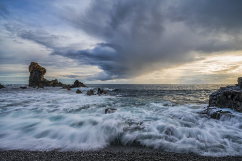 Waves crash against the shoreline of Djupalonssandur beach at sunset, Snaefellsness Peninsula; Iceland Poster Print by Robert Postma / Design Pics - Item # VARDPI12546854