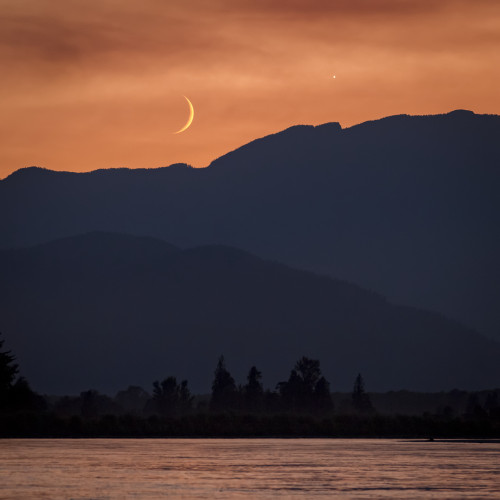The moon and Venus in an orange sky over the silhouetted mountains, Fraser Valley; Vancouver, British Columbia, Canada Poster Print by Aaron Von Hagen / Design Pics - Item # VARDPI12515833