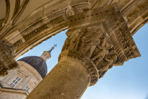 Detail of columns in the Rector's Palace facade and the Cathedral in the background; Dubrovnik, Dubrovnik-Neretva County, Croatia Poster Print by Dosfotos / Design Pics - Item # VARDPI12555587