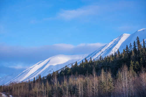 Clouds over mountain tops as daylight fades on the Chugach Mountains in South-central Alaska; Alaska, United States of America Poster Print by Michael Jones / Design Pics - Item # VARDPI12548461