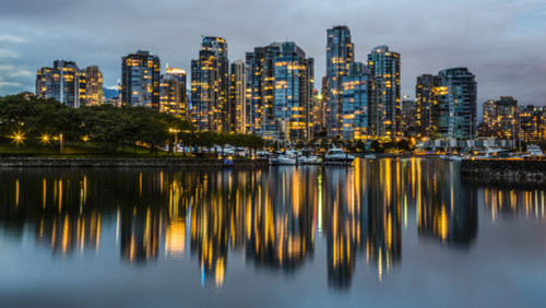 Skyline of residential buildings along the waterfront with boats in the harbour at dusk; Vancouver, British Columbia, Canada Poster Print by Aaron Von Hagen / Design Pics - Item # VARDPI12515838