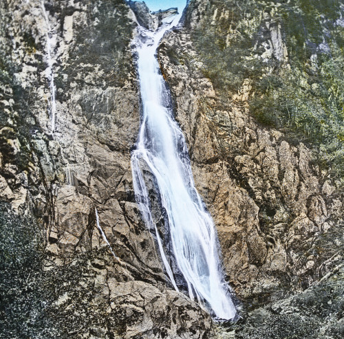 Magic Lantern slide circa 1900 hand coloured created 1887 A tour North Wales 21 Aber WaterfallA visit this beautiful cascade may be made basis a morning's excursion It is situated about two miles beyond little village Aber which lies five miles Bang