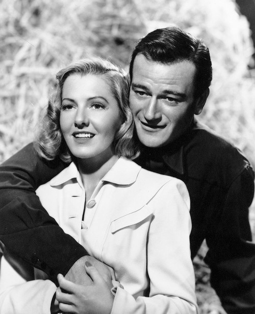 John Wayne with Jean Arthur Poster Print by Hollywood Photo Archive Hollywood Photo Archive