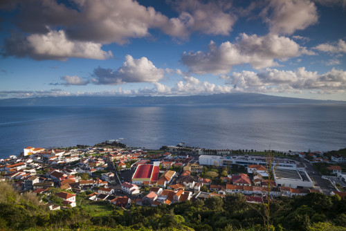 Portugal, Azores, Sao Jorge Island, Velas. Elevated town view Poster Print by Walter Bibikow - Item # VARPDDEU23WBI1100 Portugal, Azores, Sao Jorge Island, Velas. Elevated town view Poster Print by Walter Bibikow - Item # VARPDDEU23WBI1100