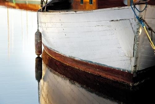 USA, Washington State, Seattle. Wooden boat reflects on lake.  Poster Print by Jaynes Gallery