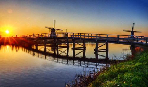Netherlands, Kinderdijk. Windmill and bridge along the canal at sunrise Poster Print by Terry Eggers - Item # VARPDDEU18TEG0097
