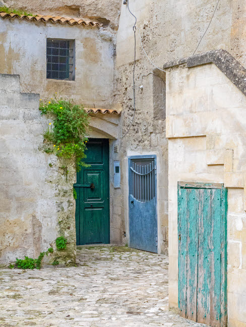 Italy, Basilicata, Matera Doors in a courtyard in the old town of Matera Poster Print by Julie Eggers (18 x 24) # EU16JEG0872