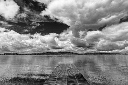 Dock reaches out into Skidoo Bay in Flathead Lake near Polson, Montana, USA Poster Print by Chuck Haney - Item # VARPDDUS27CHA4234