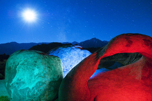 USA, California, Alabama Hills. Mobius Arch and rocks lit with colors on moonlit night. Poster Print by Jaynes Gallery - Item # VARPDDUS05BJY1373