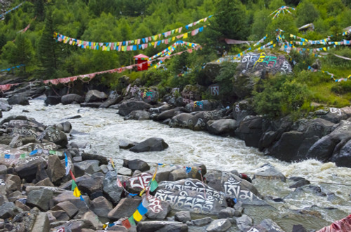 Buddhist words painted on rocks and praying flags by the river, Tagong, western Sichuan, China Poster Print by Keren Su - Item # VARPDDAS07KSU1966