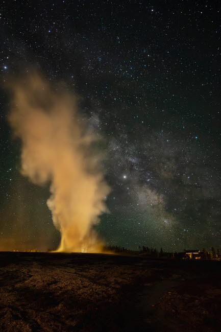 USA, Wyoming, Yellowstone National Park Milky Way and erupting Old Faithful Geyser Credit as: Don Grall / Jaynes Gallery Poster Print by Jaynes Gallery (18 x 24) # US51BJY0328