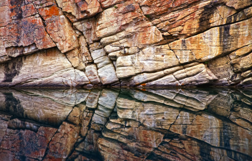 Rock wall surface reflected in tranquil water of Horseshoe Lake, Jasper National Park; Alberta, Canada Poster Print by Carson Ganci (19 x 12) # 12579003