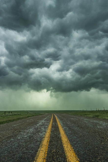 An empty highway disappears into the mouth of a storm somewhere in the Texas Panhandle; Texas, United States of America Poster Print by Stuart Short (12 x 19) # 12589814