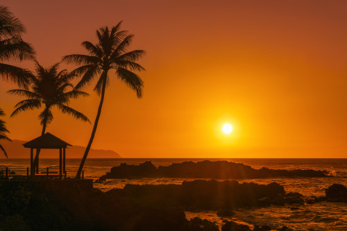 Sunset glowing in an orange sky with silhouetted rock, gazebo and palm trees along the waterfront; Oahu, Hawaii, United States of America Poster Print by 770 Productions (19 x 12) # 13612807 Sunset glowing in an orange sky with silhouetted rock, gazebo and palm trees along the waterfront; Oahu, Hawaii, United States of America Poster Print by 770 Productions (19 x 12) # 13612807