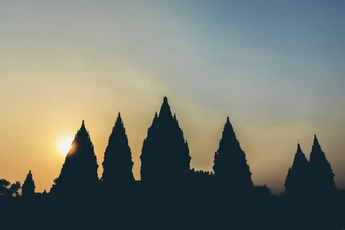 Sunset at Prambanan Temple with silhouetted peaks; Yogyakarta, Indonesia Poster Print by O'Neil Castro # 12590378