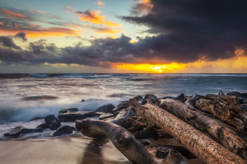 Sunrise over beach and ocean with a storm cloud and rain in the distance; Kauai, Hawaii, United States of America Poster Print by The Nature Collection (19 x 12) # 12575022