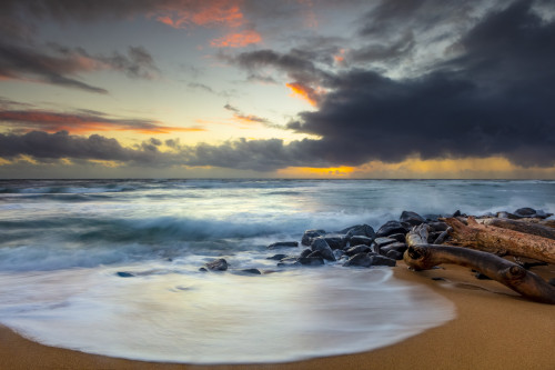 Sunrise over beach and ocean with a storm cloud and rain in the distance; Kauai, Hawaii, United States of America Poster Print by The Nature Collection (19 x 12) # 12575020
