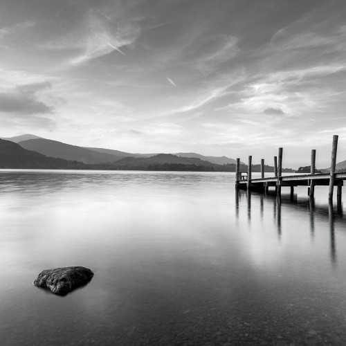 Pier on still lake by Assaf Frank (12 x 12)