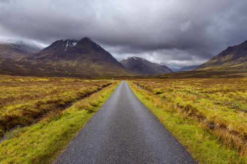 Road with mountains in the highlands at Glen Coe in Scotland, United Kingdom Poster Print by Raimund Linke (19 x 12)