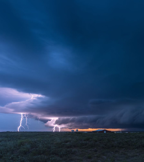 Lightning strikes from a supercell thunderstorm over the oil fields of New Mexico one evening; Maljamar, New Mexico, United States of America Poster Print by Stuart Short (15 x 17)