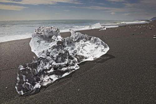 Ice on the coastal beach outslide the lagoon at Jokulsarlon, Iceland.; Jokulsarlon, Vatnajokull icecap, Iceland. Poster Print by Nigel Hicks (18 x 12)