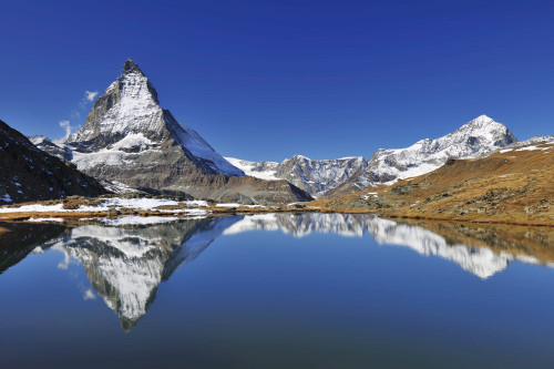 Matterhorn reflected in Lake Riffelsee, Zermatt, Alps, Valais, Switzerland Poster Print by Raimund Linke (19 x 12)