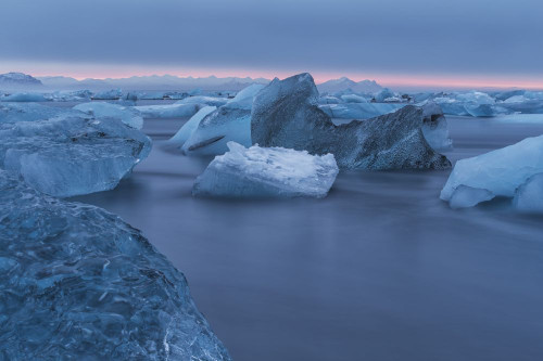 The Iceberg Filled Waters Near Jokulsarlon, Along The South Coast Of Iceland; Iceland Poster Print by Robert Postma (19 x 12)