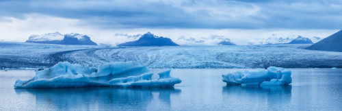 Large Icebergs In Jokulsarlon, A Glacial Lagoon Along Iceland's South Coast; Iceland Poster Print by Robert Postma (37 x 12)