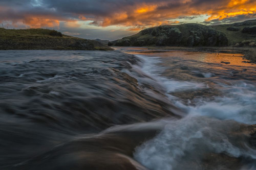 Beautiful sunset over a stream in rural Iceland; Iceland Poster Print by Robert Postma (18 x 12)