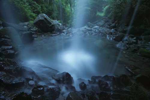 Motion blur of a cascading waterfall into a tranquil plunge pool in Great Smoky Mountains National Park, Tennessee, USA; Tennessee, United States of America Poster Print by Michael Melford (17 x 11)