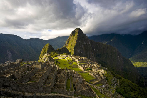 Reconstructed stone buildings on Machu Picchu; Peru Poster Print by Michael Melford (17 x 11)