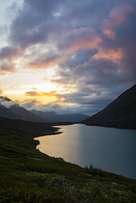 Dramatic sunset light glowing in clouds over Chugach State Park in Alaska, USA; Alaska, United States of America Poster Print by Alex Rearick (11 x 17)