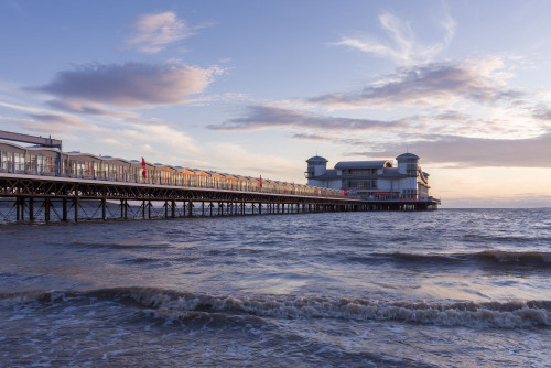 The Grand Pier during high tide at the English seaside town of Weston-super-Mare. Poster Print by Loop Images Ltd. (20 x 13)