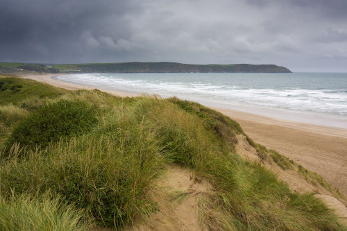 The sand dunes overlooking Woolacombe Sand on the North Devon Area of Outstanding Natural Beauty coast. Poster Print by Loop Images Ltd. (20 x 13)