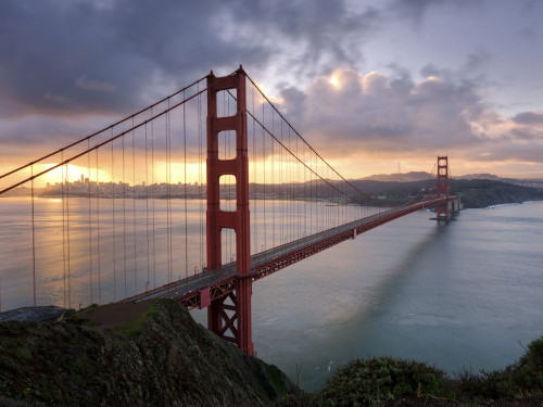 The Golden Gate Bridge in San Francisco at sunrise. Poster Print by Loop Images Ltd. (18 x 14)