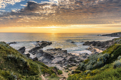 A beautiful colourful sunset over Little Fistral on the coast of Newquay in Cornwall. Poster Print by Loop Images Ltd. (17 x 11)