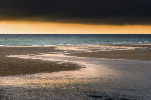 A dramatic golden sunset at a deserted Fistral Beach in Newquay in Cornwall. Poster Print by Loop Images Ltd. (17 x 11)