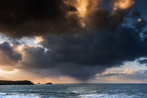 A dramatic fiery sky at sunset over Fistral in Newquay in Cornwall. Poster Print by Loop Images Ltd. (17 x 11)