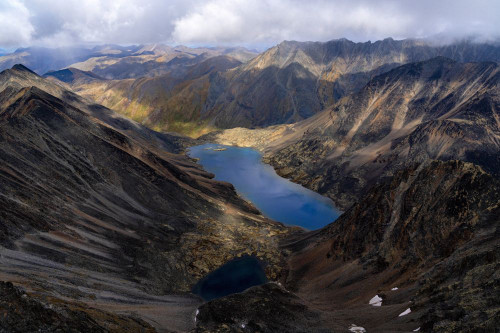 Aerial views of the Tombstone Range and Azure Lake along the Dempster Highway in Tombstone Territorial Park in the Yukon Territory; Yukon, Canada Poster Print by Robert Postma (18 x 12)