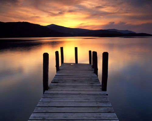 Sunset over Derwentwater from the Ashness jetty on Barrow Bay. Poster Print by Loop Images Ltd. (18 x 14)