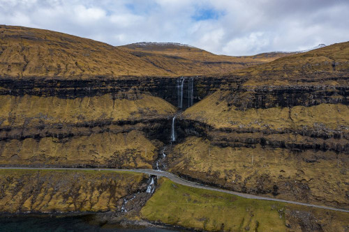 A waterfall on the Faroe Islands. Poster Print by Loop Images Ltd. (18 x 12)