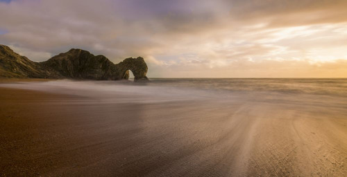 The beach at Durdle Door in Dorset. Poster Print by Loop Images Ltd. (21 x 11)