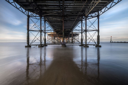 Looking out to see under the pier at Cromer. Poster Print by Loop Images Ltd. (20 x 13)