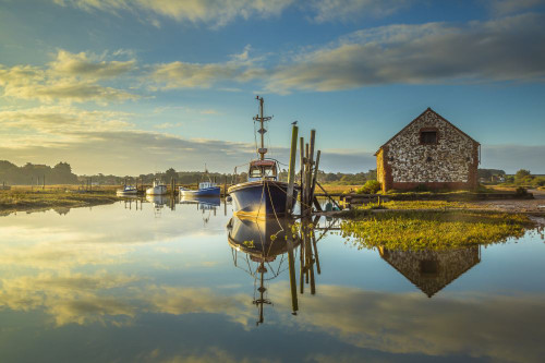 Sunrise and a mirror calm high tide coincide at Thornham creek in North Norfolk. Poster Print by Loop Images Ltd. (19 x 12)